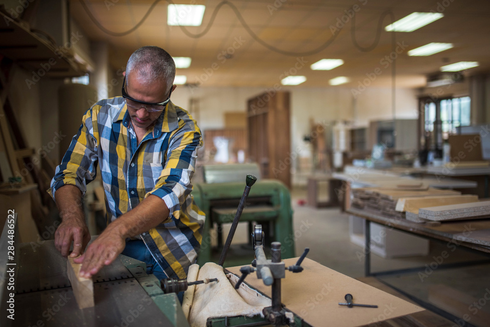 the master uses a woodworking machine the master uses a woodworking machine