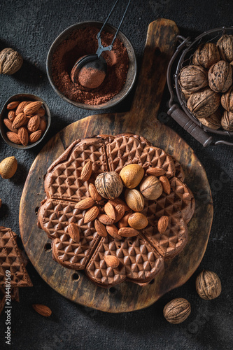 Homemade and fresh waffles with dark chocolate and almonds