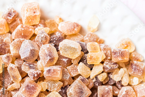 Cane sugar in crystal cubes, fragrant brown sugar for tea and coffee