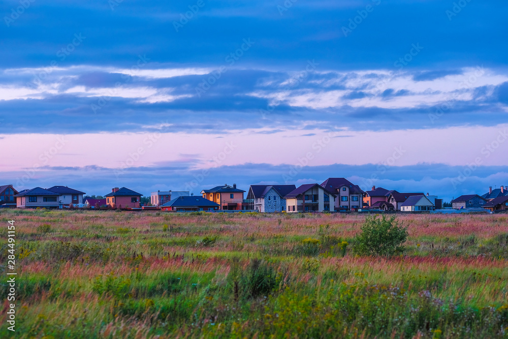 Fototapeta premium Landscape with the image of country side at sunset