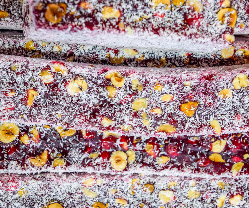 Marmalade sticks with cashew nuts, sprinkled with coconut. East sweets from india