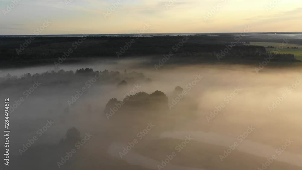 Autumn valley with fog at sunrise Autumn valley with fog at sunrise