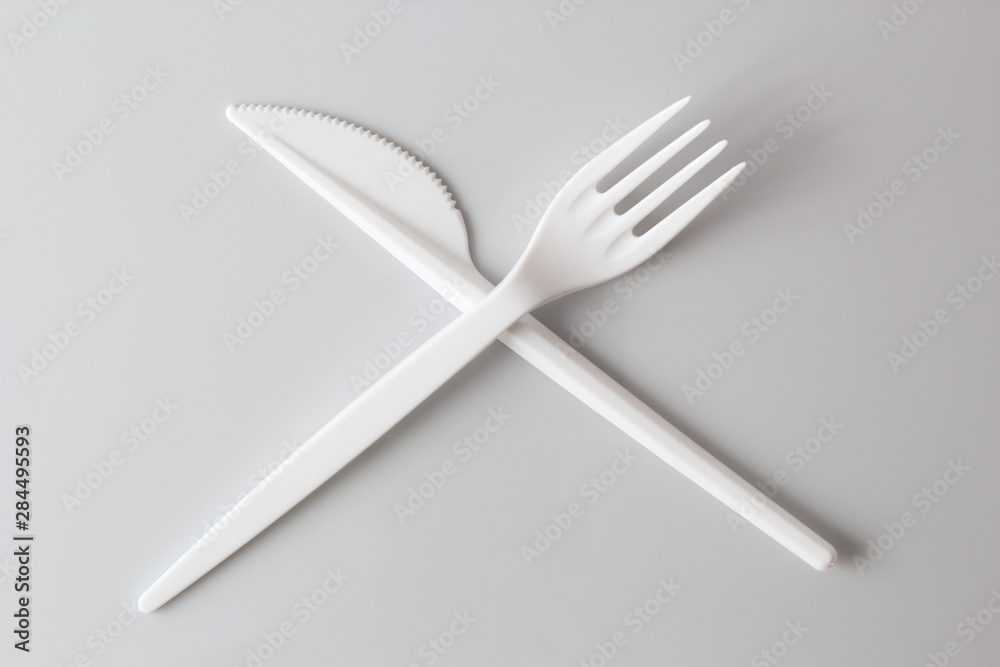 Disposable Plastic Fork and Knife. Isolated with clipping path. Disposable Plastic Fork and Knife. Isolated with clipping path.