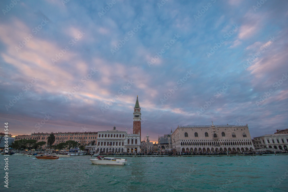 View on San Marco square from water. Tower on San Marco. Venice, Italy beautiful cityscape with clouds. Boat trip in Venice. Arrival to Venice. Departure from Venice