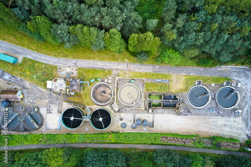 Quadro su tela Sewage water works treatment plant aerial view from above showing waste quality