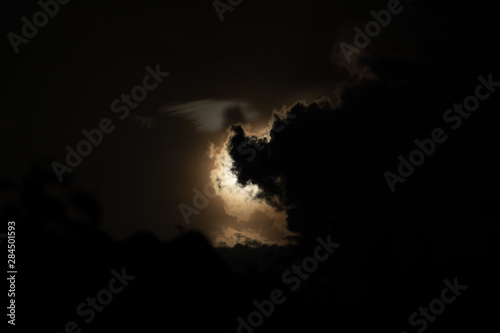 Moon light behind cloud