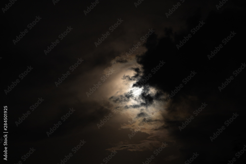 Moon light behind cloud Moon light behind cloud