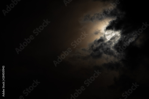 Moon light behind the cloud