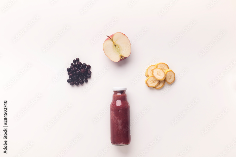 Combination of fresh fruits in glass bottle for healthy nutrition Combination of fresh fruits in glass bottle for healthy nutrition