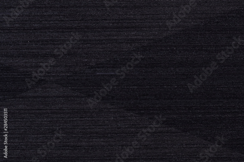 Stylish black veneer background as part of your strict design. High quality texture in extremely high resolution. 50 megapixels photo.