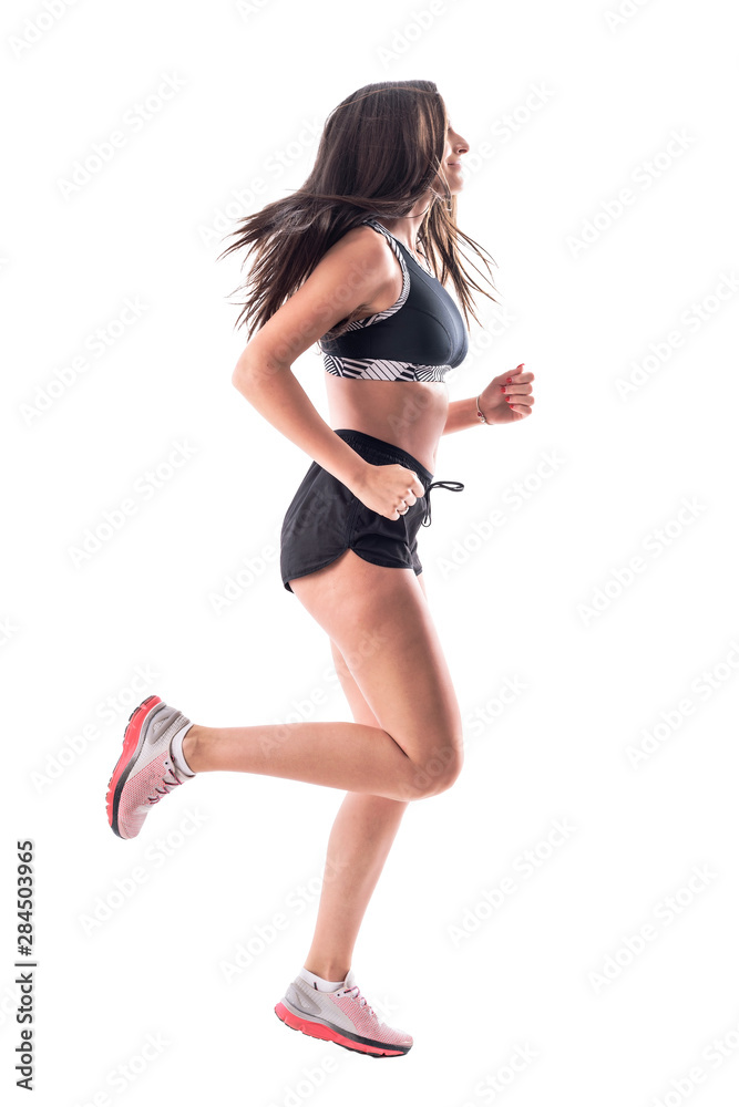 Side view dynamic photo of active fit young woman running with flying long hair. Full body isolated on white background. Side view dynamic photo of active fit young woman running with flying long hair. Full body isolated on white background.