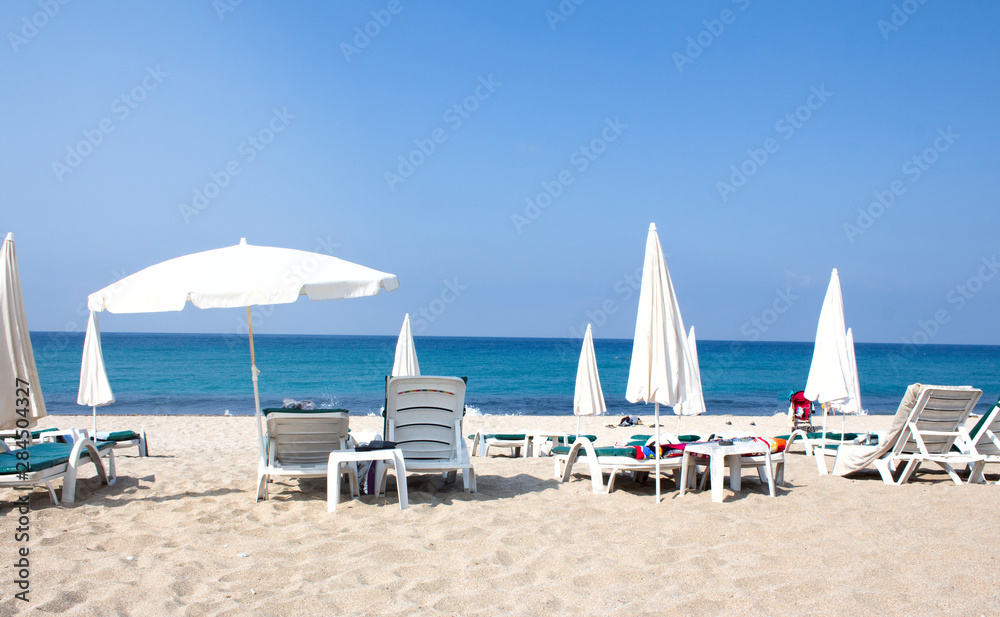  Bed beach.Chairs on the sandy beach near the sea. Summer holiday and vacation concept for tourism.