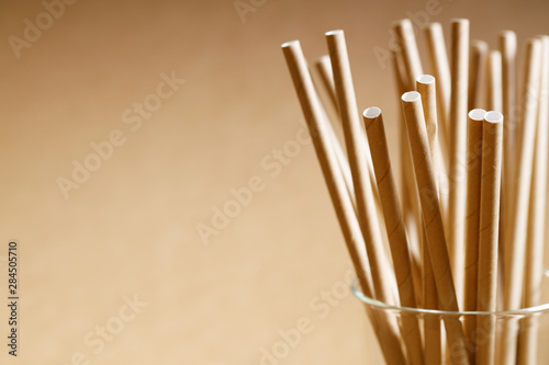 Brown paper straws in glass photo