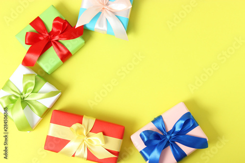 gifts on a colored background top view. Holiday  giving presents  birthday.