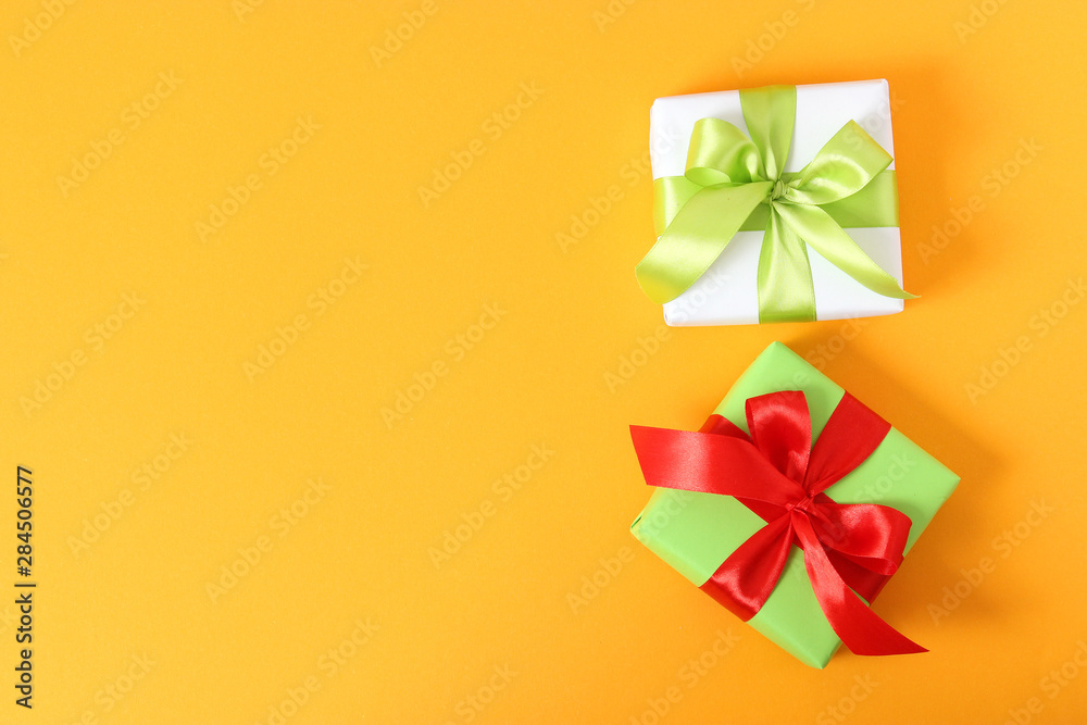 gifts on a colored background top view. Holiday, giving presents, birthday.