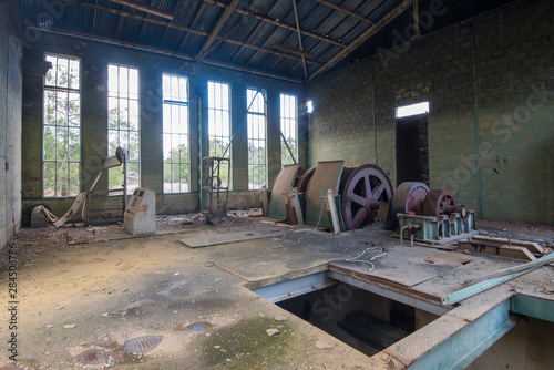 Interior room with the machinery  of an abandoned copper mine. photo