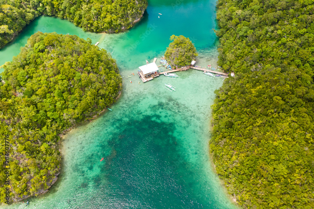 Cove And Blue Lagoon Among Small Islands Covered With Rainforest Sugba