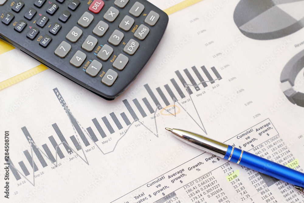 Business concept with a report and a calculator Business concept with a report and a calculator