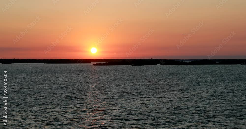 Sweden. Beautiful Seascape In Sunset Sunrise Time. Sun Sunshine Above Rocky Islands Archipelago. Sunny Summer Evening Sweden. Beautiful Seascape In Sunset Sunrise Time. Sun Sunshine Above Rocky Islands Archipelago. Sunny Summer Evening