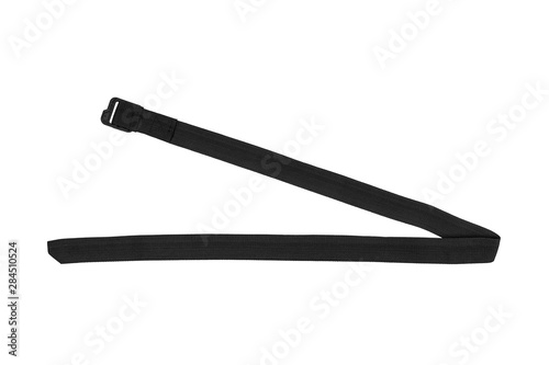 Black nylon fastening belt, strap isolated on white background.