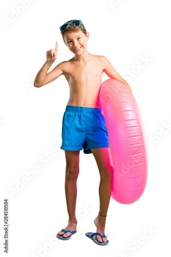 A full-length shot of Child on summer vacation counting number one sign on isolated white background