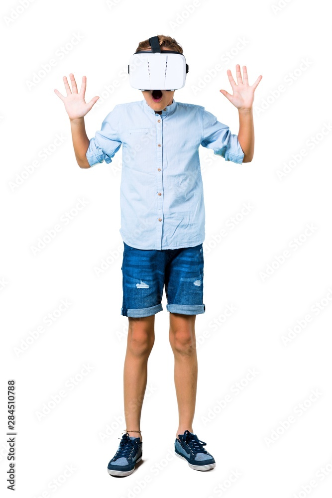 Little kid using VR glasses on isolated white background Little kid using VR glasses on isolated white background