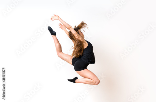 Young dance girl over isolated white wall.