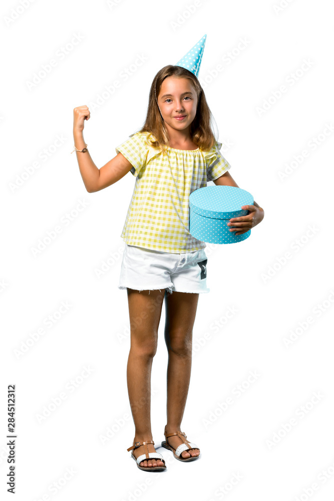 A full-length shot of a Little girl at a birthday party holding a gift celebrating a victory on isolated white background A full-length shot of a Little girl at a birthday party holding a gift celebrating a victory on isolated white background