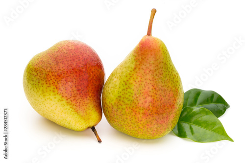 Fresh bio pear with leaves on isolated white background.