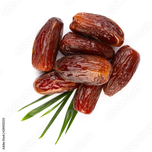 Dry dates isolated on white background. Top view. Flat lay pattern.