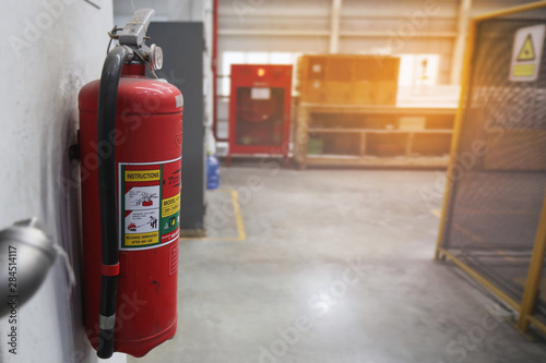 Dry chemical fire extinguisher were mounted on the walls of  working area.