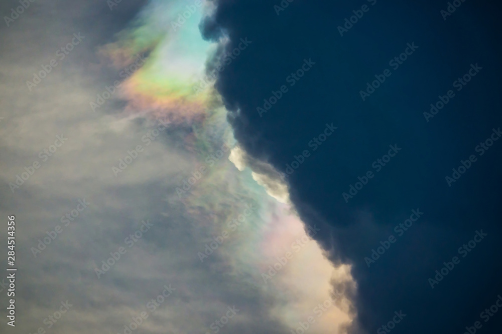 Nature phenomenon, cosmic rainbow sky cloud, nature phenomenon of sun light against storm clouds. Nature phenomenon, cosmic rainbow sky cloud, nature phenomenon of sun light against storm clouds.