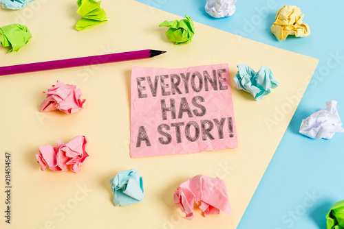 Conceptual hand writing showing Everyone Has A Story. Concept meaning account of past events in someones life or career Colored crumpled papers empty reminder blue yellow clothespin © Artur