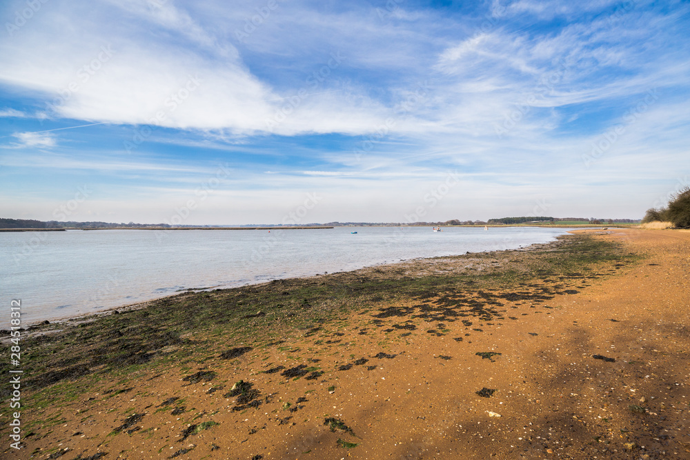 An empty beach on the banks of the river Deben, in Suffolk