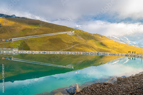 Fallbodensee lake with amazing mountain reflection in Jungfrau region, Switzerland photo