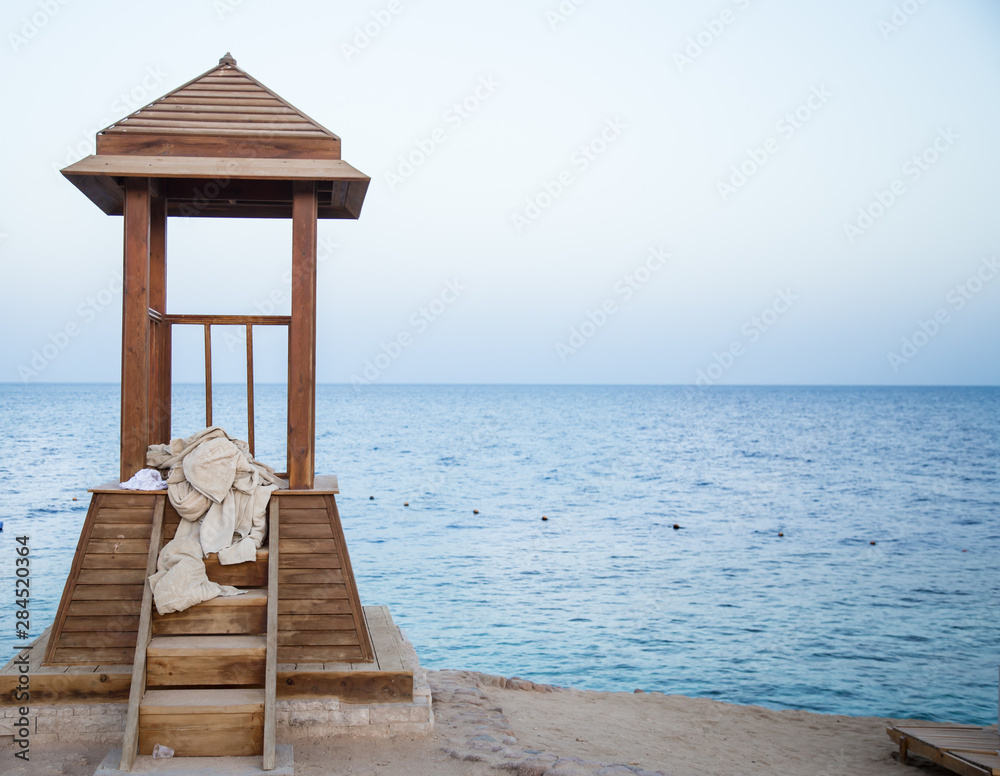 wooden gazebo for lifeguards on the ocean