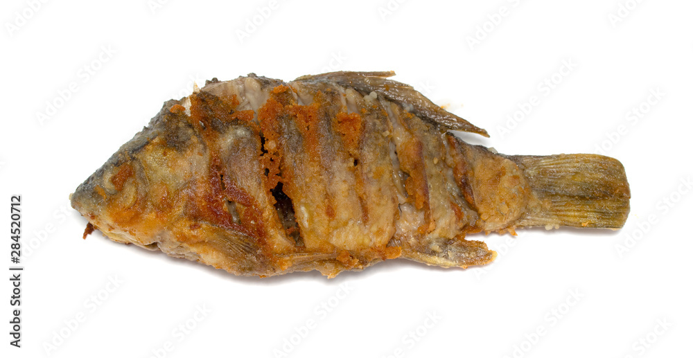 Fried fish on a plate, white background. Fried fish on a plate, white background.
