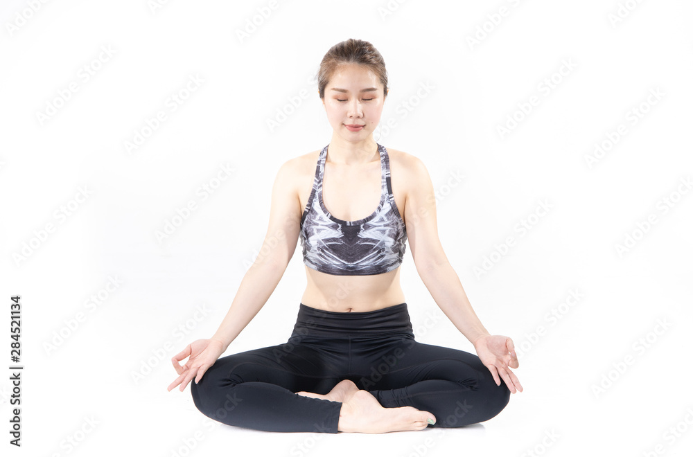 Sporty Asian young woman doing yoga practice isolated on white background.