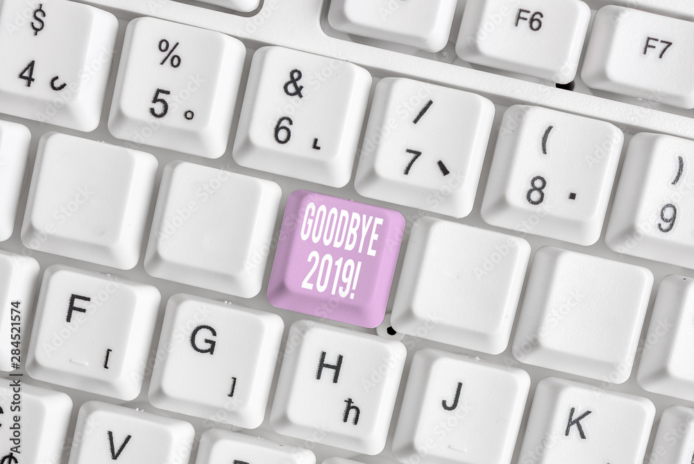 Word writing text Goodbye 2019. Business photo showcasing express good wishes when parting or at the end of last year White pc keyboard with empty note paper above white background key copy space