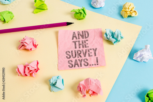 Conceptual hand writing showing And The Survey Says. Concept meaning written spoken results of short quiz or exam on internet Colored crumpled papers empty reminder blue yellow clothespin © Artur