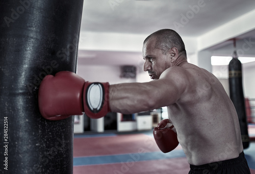 Boxer training at heavy bag