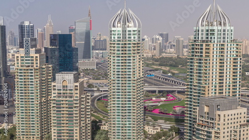 Aerial top view of Dubai Marina morning timelapse. Modern towers and traffic on the road photo