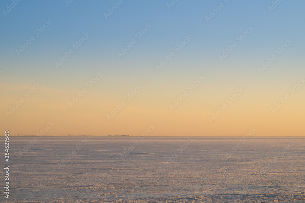 Frozen lake at evening landscape background. horizon line