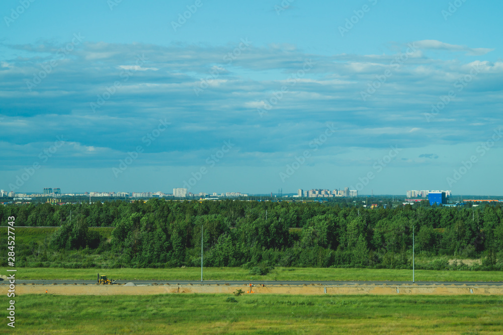 Urban cityscape panoramic view. horizon line with buildings. landscape with town and forest. city into a distance