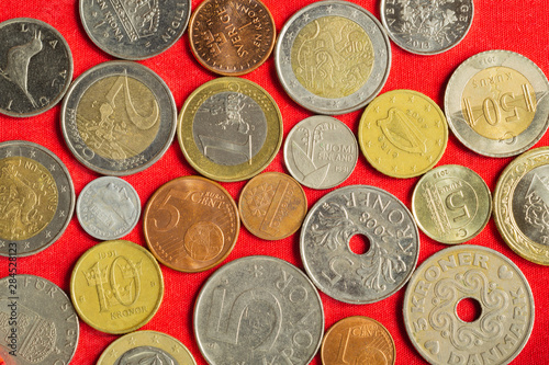 Coins of the various countries. many metal coins of different denominations and different countries. finance background