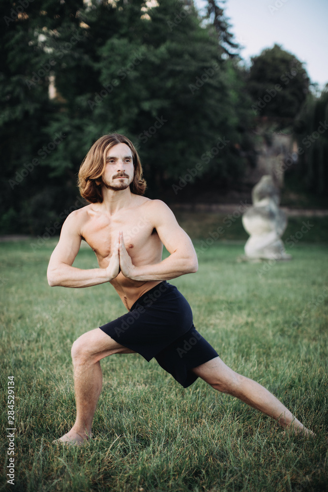 sporty man practicing yoga outdoor sporty man practicing yoga outdoor