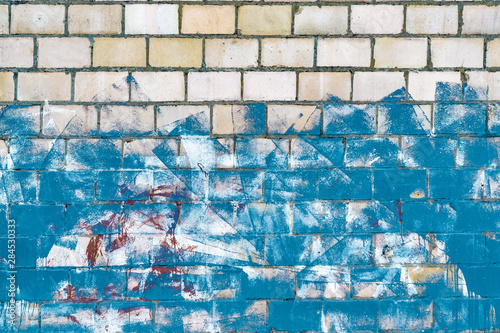 background with brick wall smeared with blue paint