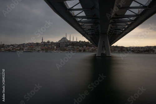 Halic (golden horn) metro bridge and suleymaniye mosque in Istanbul