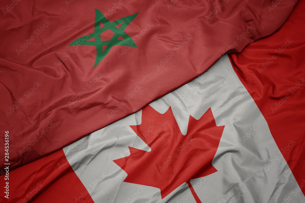 waving colorful flag of canada and national flag of morocco. waving colorful flag of canada and national flag of morocco.