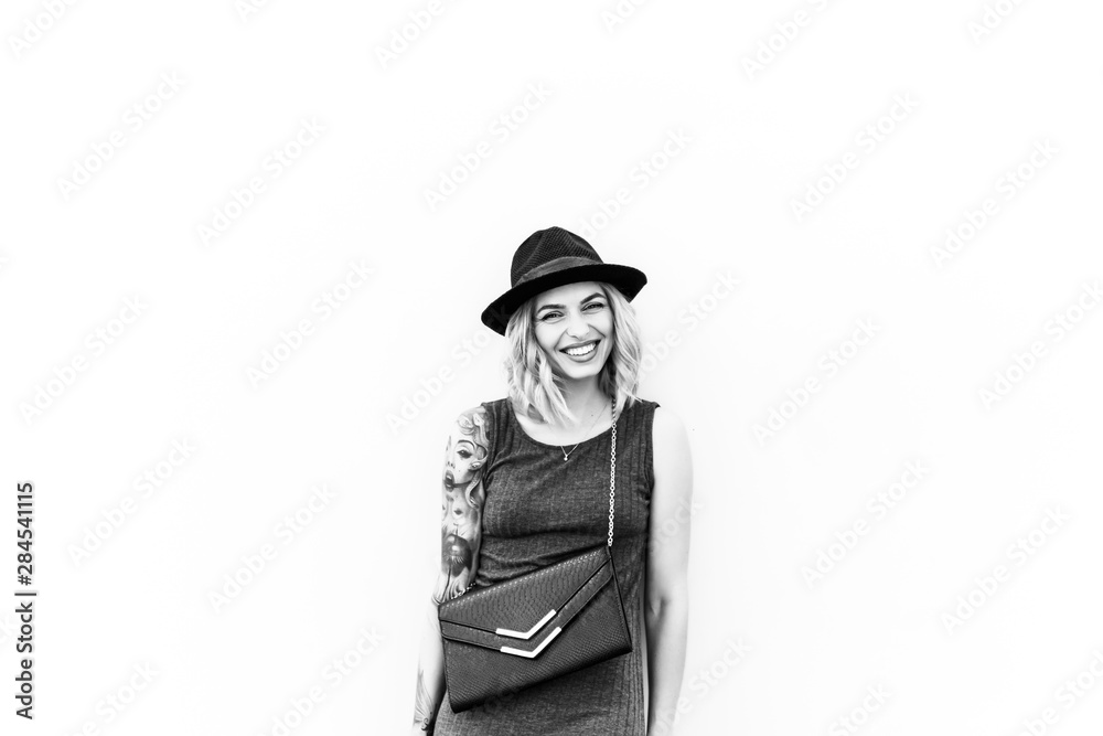 emotional portrait of Fashion stylish portrait of pretty young hipster blonde woman,going crazy,elegant black hat,soft colors,cool crazy girl.Red urban wall background.surprised girl close up, sunset emotional portrait of Fashion stylish portrait of pretty young hipster blonde woman,going crazy,elegant black hat,soft colors,cool crazy girl.Red urban wall background.surprised girl close up, sunset